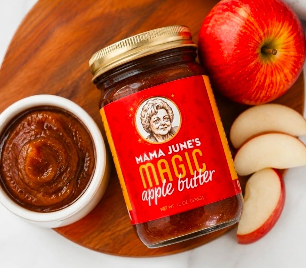 Mama June’s Magic Apple Butter jar with apple slices and a bowl of apple butter