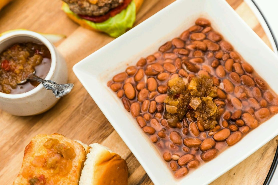 Baked beans and sandwiches served with relish